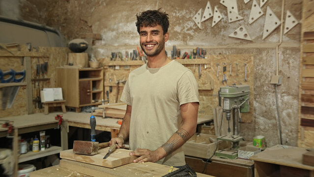 Man carpenter face portrait. Male carpentry work skill. Joiner guy timber woodwork. Happy worker smile. Serious person woodworker look at camera. Wood diy master class workshop. Many tools background.