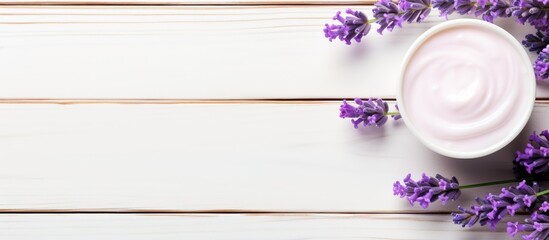 Moisturizer cream beside lavender flowers on rustic white table