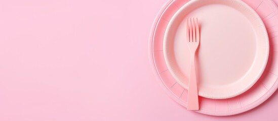 Pink plate with cutlery
