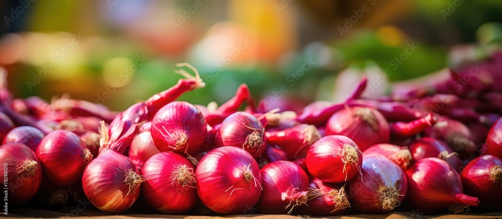 Aufkleber red onions stacked on a table