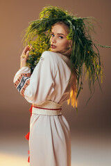 A young mavka, adorned in a traditional garment, gracefully balances a plant on her head in a fairy-like studio setting.