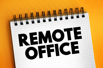 Remote Office - practice of employees doing their jobs from a location other than a central office operated by the employer, text concept on notepad