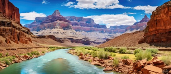 River flowing through rocky canyon amid towering peaks