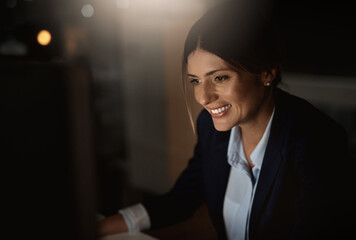 Smile, thinking and woman in dark office with computer for research, website review or networking....
