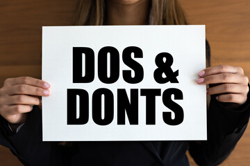 Dos and Donts. Woman with white page, black letters.Right or not right, choice, instructions.