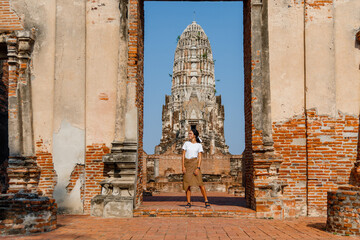Tourist woman in Wat Ratburana Temple in Ayutthaya Historical Park, a UNESCO world heritage site,