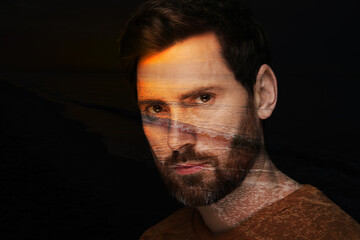 Double exposure of handsome man and sea at sunset