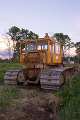 Fototapeta na wymiar Tractor CHTZ-URALTRAK T-130. A bulldozer. A Soviet agricultural and industrial tracked tractor produced by the Chelyabinsk Tractor Plant.