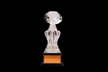 Trophies with diamond shaped crystal toppers, trophies made of acrylic or glass. on a black background
