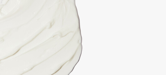 White cosmetic cream smeared on a white background.