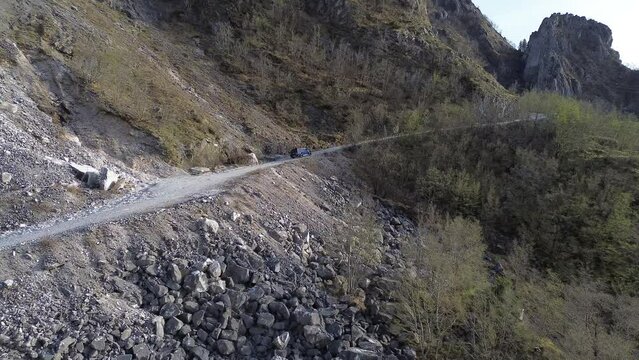 Aerial View Of an Off-road Vehicle On a Mountain Road 4K