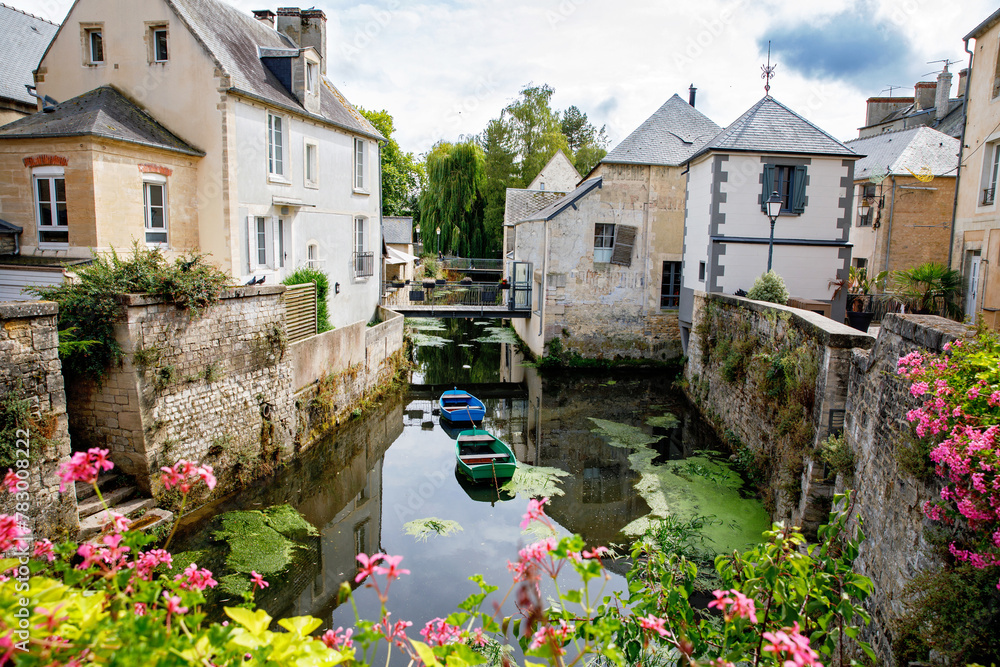 Wall mural The water mill on the River Aure in the medieval town of Bayeux on the Normandy Coast of France.