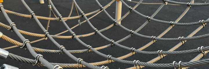 An intricate rope and net texture, evoking adventure and play