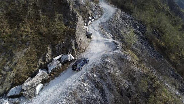 Aerial View Of an Off-road Vehicle On a Mountain Road 4K