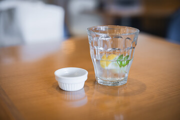 Lemon water on a table in a restaurant.