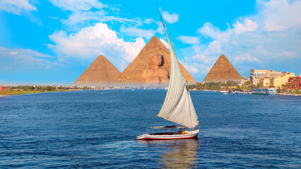 Beautiful Nile scenery with traditional Felluca sailing boat in the Nile on the way to Giza pyramids and The great Sphinx  - Cairo, Egypt  