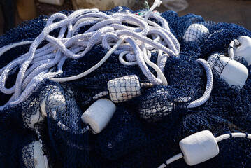 A balled-up blue professional fishing net.