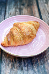 Crispy, fresh croissants, Concept of food, bakery, breakfast ideas, taste, freshness. Poser. Copy space for ad