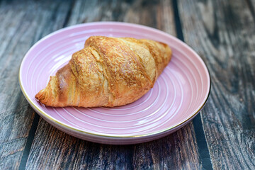 Crispy, fresh croissants, Concept of food, bakery, breakfast ideas, taste, freshness. Poser. Copy space for ad