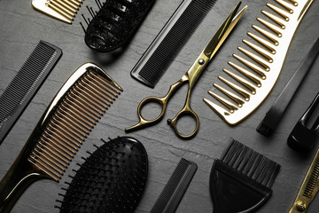 Hairdressing tools on grey textured background, flat lay