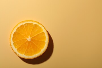 Slice of juicy orange on beige background, top view. Space for text