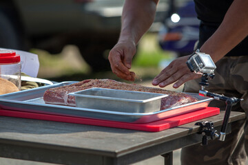 View of seasoning the barbecue meat