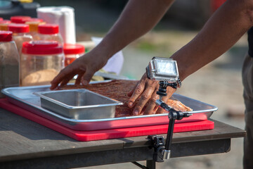 View of seasoning the barbecue meat