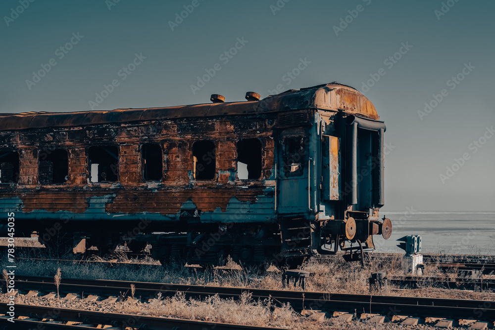 Wall mural damaged and burnt trains in Ukraine