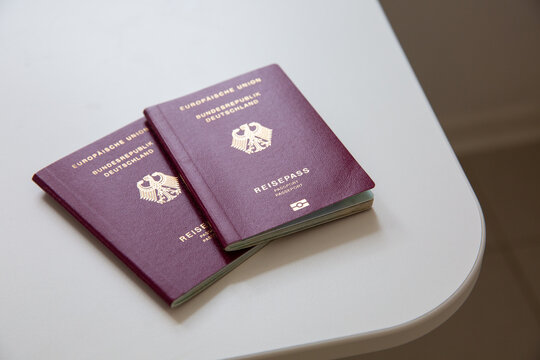 Cose up of two German passport on white table background