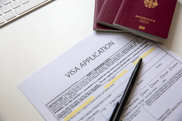 Close up of a visa application document with a German passport