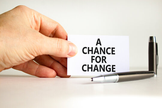 A chance for change symbol. Concept words A chance for change on beautiful white paper. Beautiful white background. Voter hand. Business A chance for change concept. Copy space.