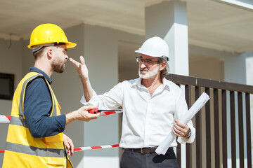 Businessman talking with a contractor.