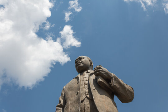 Birmingham Alabama, USA - May 16, 2019 View looking up at bronze statue of Martin Luther King Jr in Kelly Ingram Park, horizontal aspect