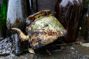 Stockhom, Sweden Glass bottles and a teapot picked up by  scuba divers picking up trash from the bottom of the Palsundet canal in downtown Stockholm.