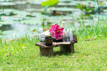 Spa massage wellness decorations setting on wood table. Thai spa massage traditional compress for...