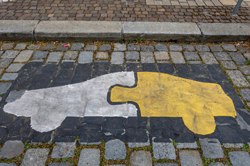 Vienna, Austria  An electric car charging symbol on the street looks like a puzzle piece.