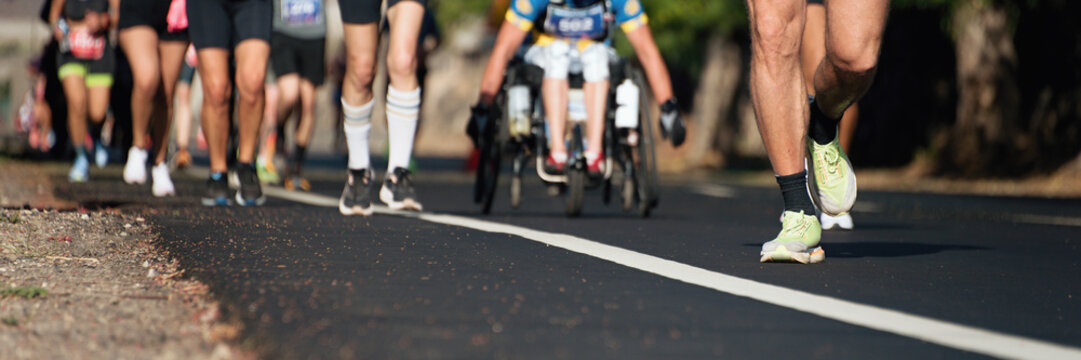 Marathon running race, people feet on city road