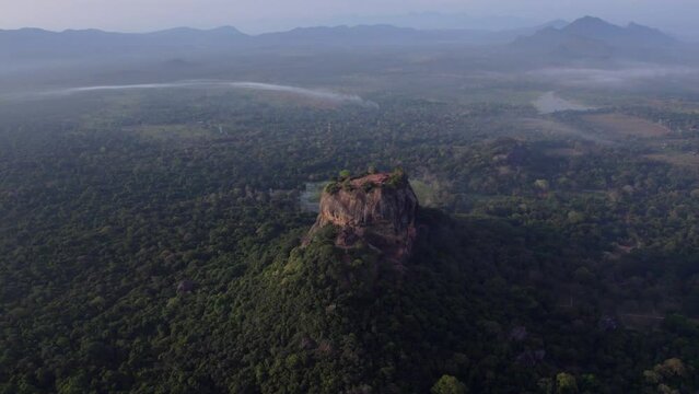 Aerial drone footage of Sigiriya The Ancient Rock Fortress and green nature in Sri Lanka