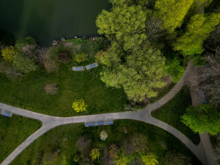 park paths in arches on the shore of the lake in an English-style park. fly over the pond