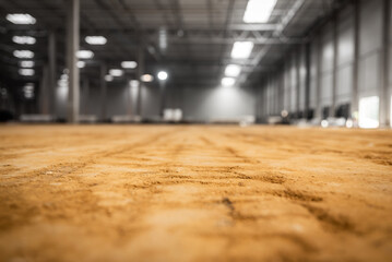 hardening of the industrial floor inside the warehouse hall - yellow industrial sand - factory construction stage