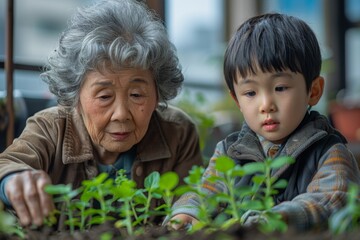 Elderly woman and young boy attentively tending to plants, a moment of shared learning.