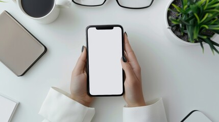 Top view of woman s hands using digital tablet and scrolling on iphone at white desk