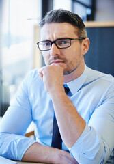 Fototapeta premium Frustrated, man and thinking in professional office for startup company, brainstorming and idea. Businessman, management and development for career, planning and innovation for corporate enterprise.
