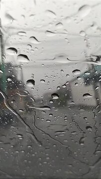heavy rain raindrops on the car window