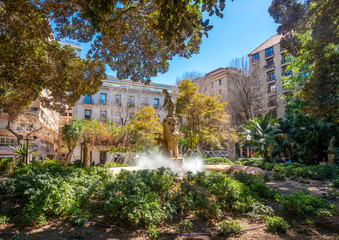 Charming public squares with plenty of shade, subtropical plants and beautiful landscaping dotting the old city center of Alicante, Spain