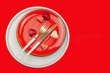 Minimalist spring table setting with sweet chocolate candies. Traditional festive symbol