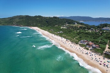 Mole beach aerial view, Florianopolis island, Santa Catarina. Conceicao Lake at background.