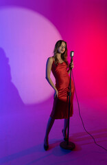 Singer in Red Performing at Colorful Stage Setup Backstage shot.