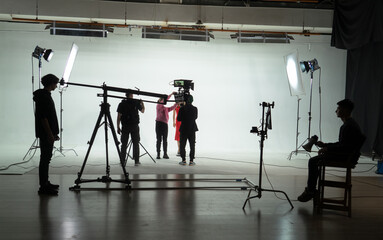 Filming an actress by a film crew on the set Backstage shot.