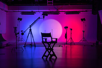 Director's Chair and Equipment in Colorful Studio Backstage shot.